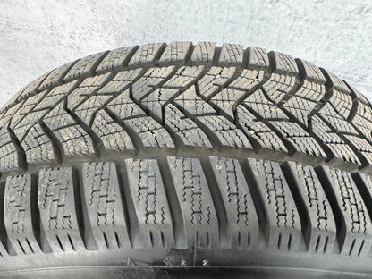 010577